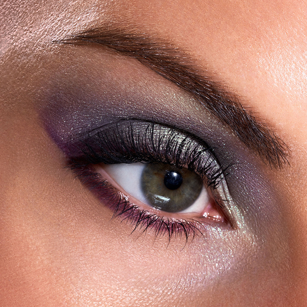 Close-up of a woman's right eye with smoky shimmery eye makeup from the LiveGlam Moody shadow palette