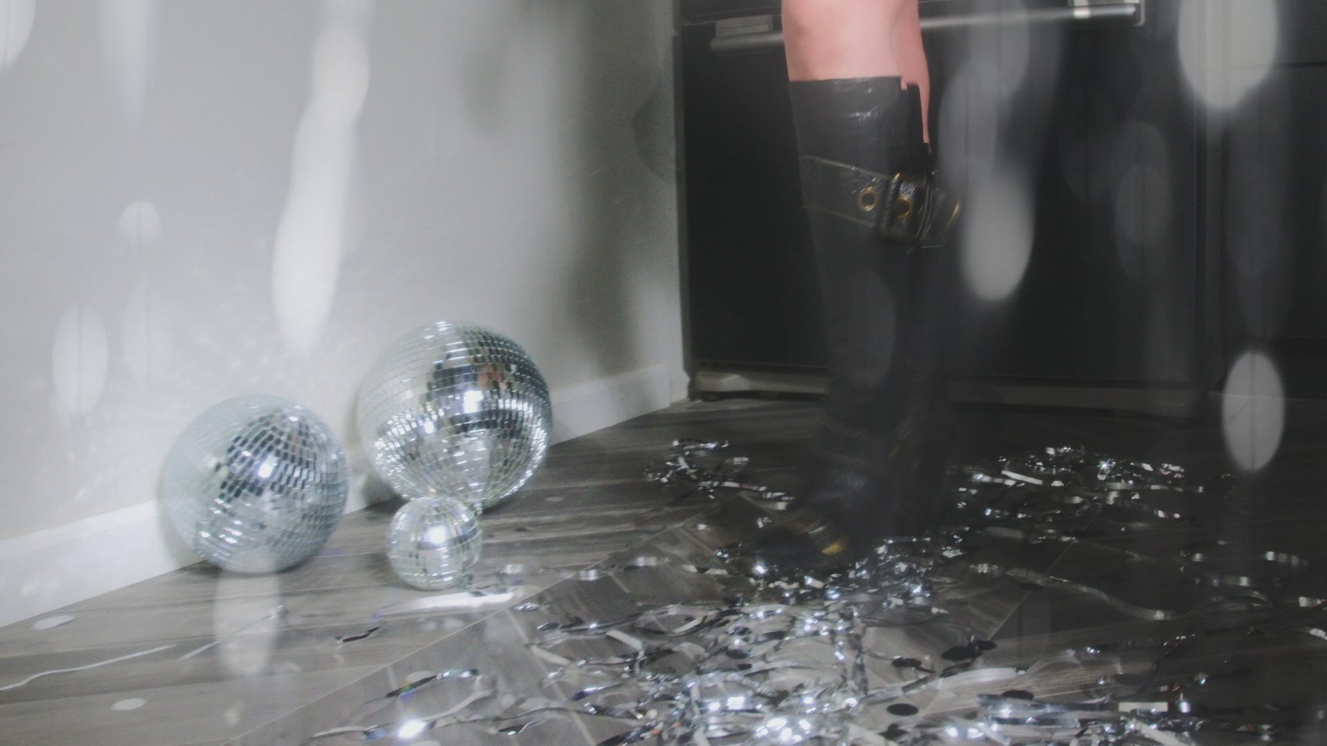 Load video: The model for the collection Manifest It! dances on tinsel beneath a disco ball and shows off the 'ROSY Cheeky Kiss Cream Stick', 'CLASSY Faux Mink Lashes', the 'IQ-UTIE Lip Liner', and the 'POP, CLINK, SMOOCH liquid Lippie'